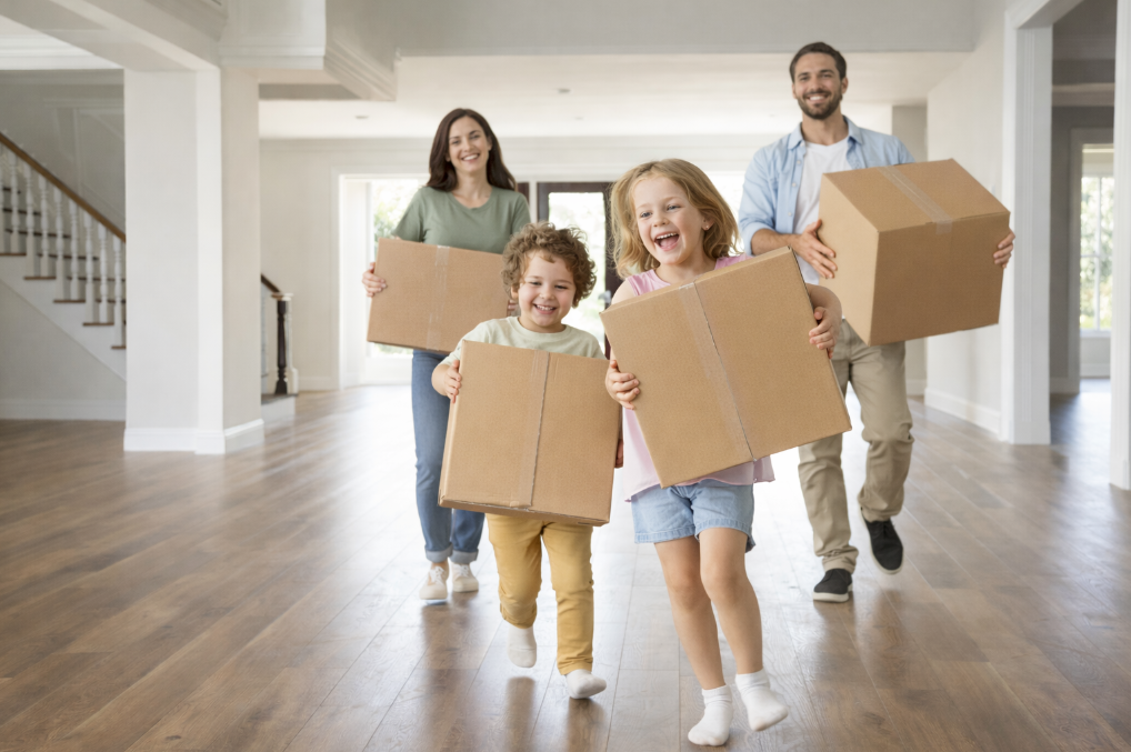 Happy family moving into a new home